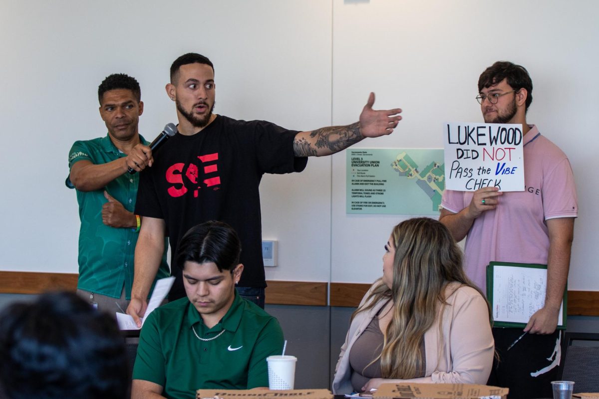 Third-year ethnic studies major William Robey delivers remarks criticizing President Luke Wood on August 15, 2024, garnering applause from other students in attendance. Wood left the town hall after his opening speech.