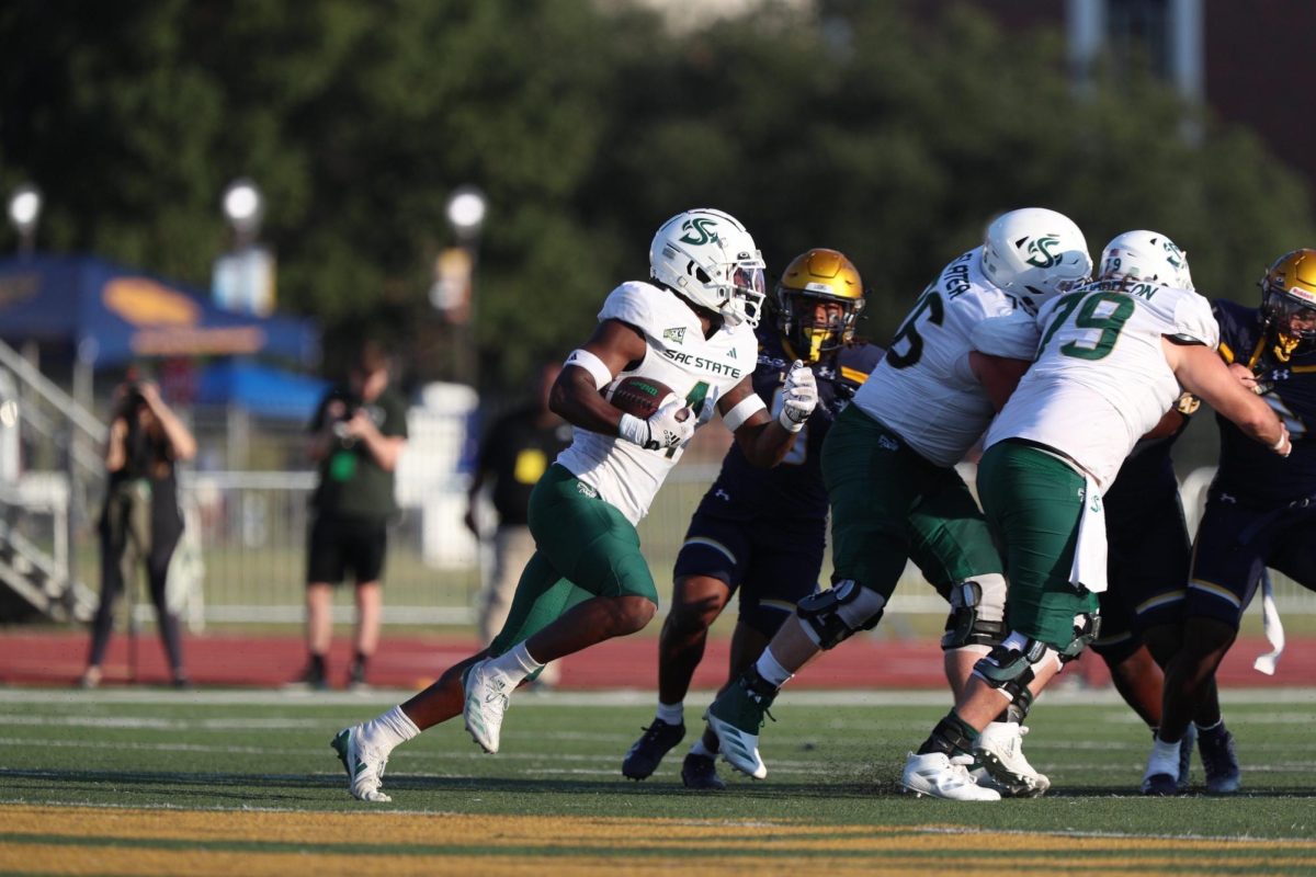 Sac State junior running back Elijah Tau-Tolliver running against the Texas A&M Commerce’s defense Saturday, Sept. 21, 2024. Tau-Tolliver ran for 127 rushing yards and had a receiving touchdown in the 34-0 win.