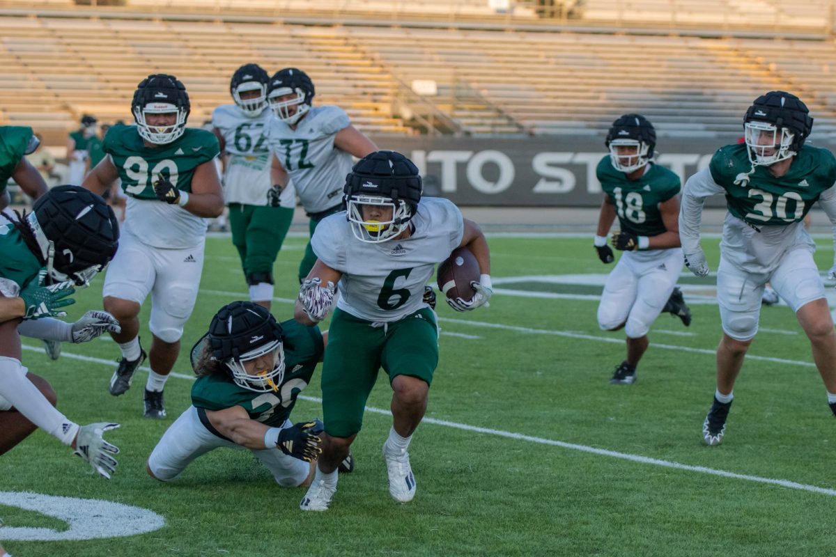 Senior running back Ezra Moleni breaking tackles during practice Aug. 8. The Sacramento State Hornets will now face off against the Fresno State Bulldogs on Sept. 7 to end their FBS two-game matchup.