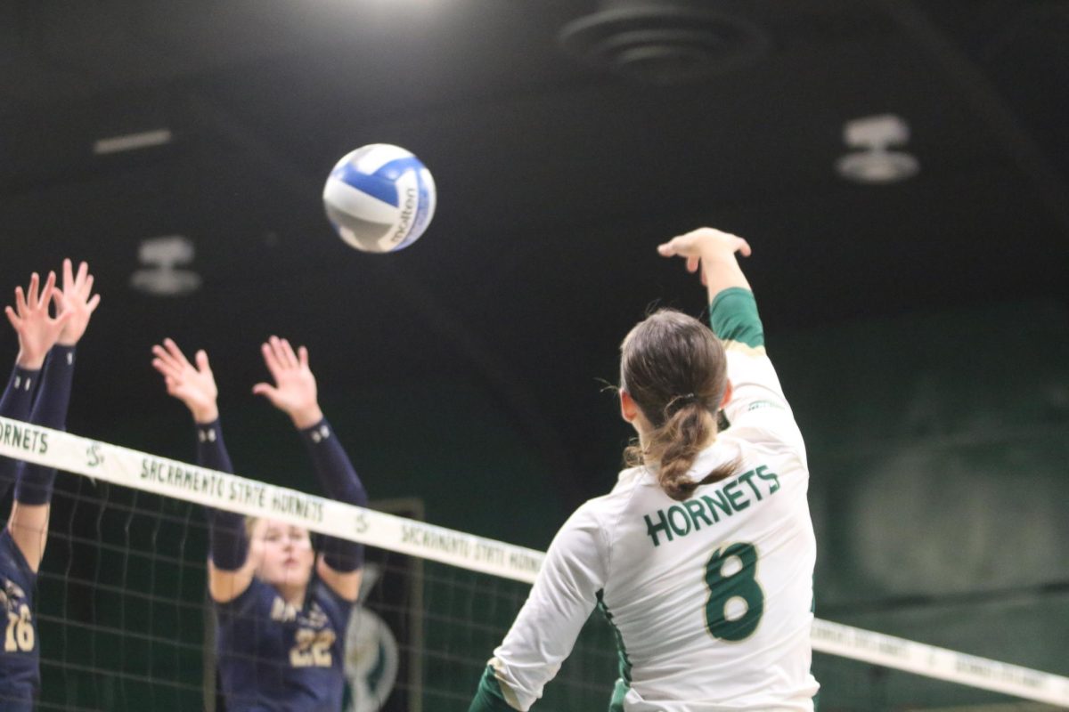 Senior outside hitter Bridgette Smith leaps in the air to spike the ball against Montana State Thursday, Sept. 26, 2024 at the Nest. The Hornets won the game 3-1.