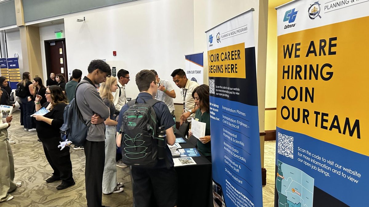 Students and alumni speak with Caltrans representatives at the Sac State Job & Internship Fair Tuesday, Oct. 1, 2024. The event allowed students to explore opportunities with a variety of employers and industries.