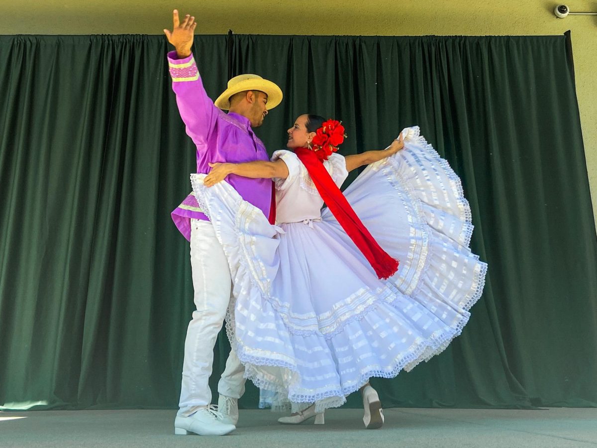 A Folklórico dance pair performs on Sac State’s amphitheater stage at Feria de Educación Saturday, Oct. 5, 2024. Feria de Educación offered workshops and resources to the Spanish-speaking community.