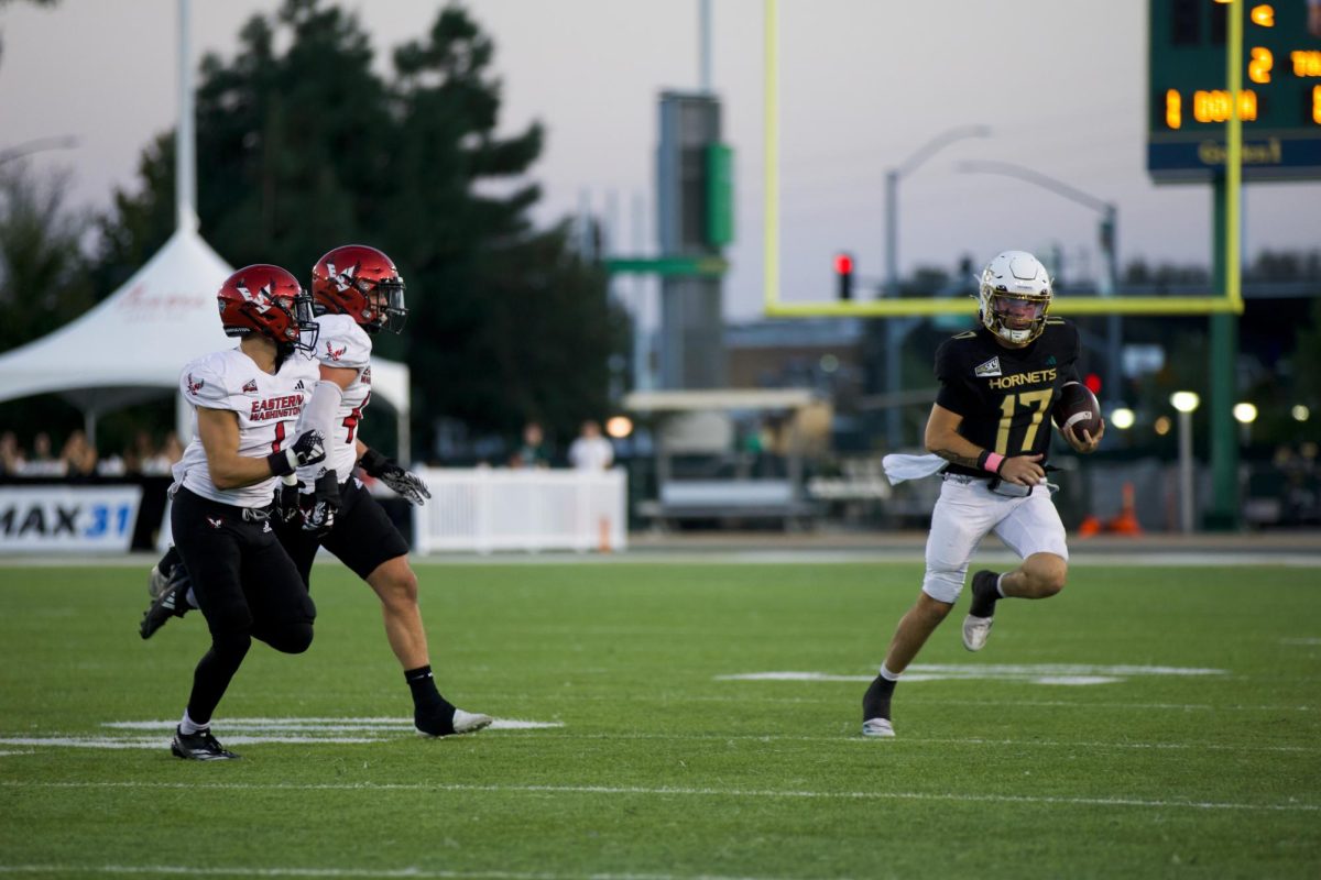 Sacramento State redshirt freshman quarterback Carson Conklin scrambling against Eastern Washington Saturday, Oct. 12, 2024. Conklin threw for 238 yards, 4 touchdowns and an interception.