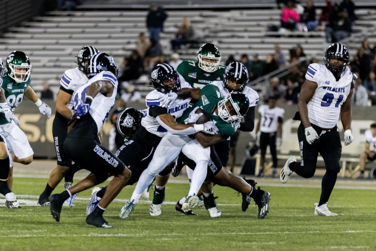 Junior running back Elijah Tau-Tolliver trying to break away from a Weber State defender in Sacramento State’s win over Weber State  Saturday, Oct. 19, 2024. Sac State found its first conference win of the season and improved to 1-2 in that category.