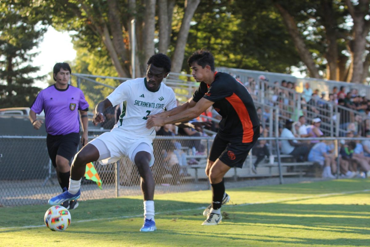 Sac State redshirt junior midfielder Stacy Holmes controlling a ball under pressure against the University of the Pacific Tigers on Sunday, Sept. 22, 2024​​. The Hornets picked up their first tie of the season against the Tigers.