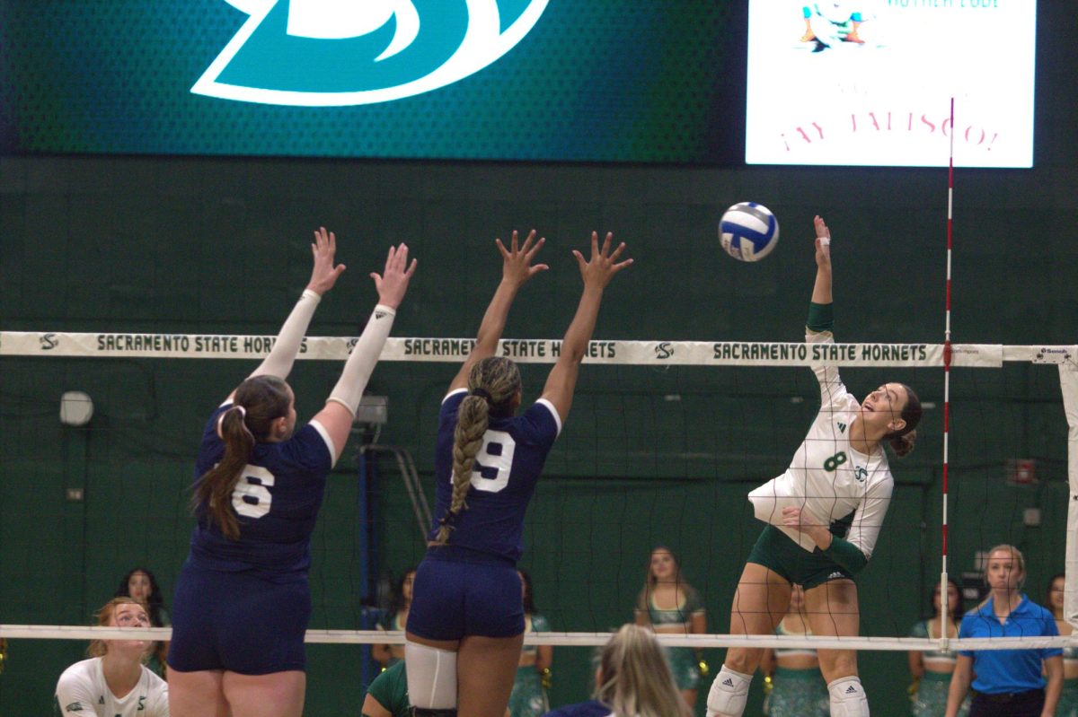 Sac State senior outside hitter Bridgette Smith jumps up for the kill against senior middle blocker Kendall Robertson and opposite hitter Sophia Wadsworth of the Northern Arizona Lumberjacks Thursday, Oct. 10, 2024. The Hornets had 56 kills compared to the Lumberjacks’ 42.