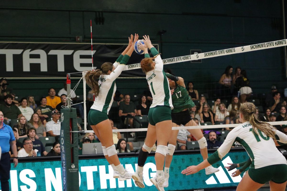 Senior outside hitter Caitlin Volkmann and sophomore middle blocker Karlie Spohn go up for the block against Portland State Friday, Oct.4, 2024. The Hornets frontline came to defend, at one point blocking the Vikings in three consecutive kill attempts.