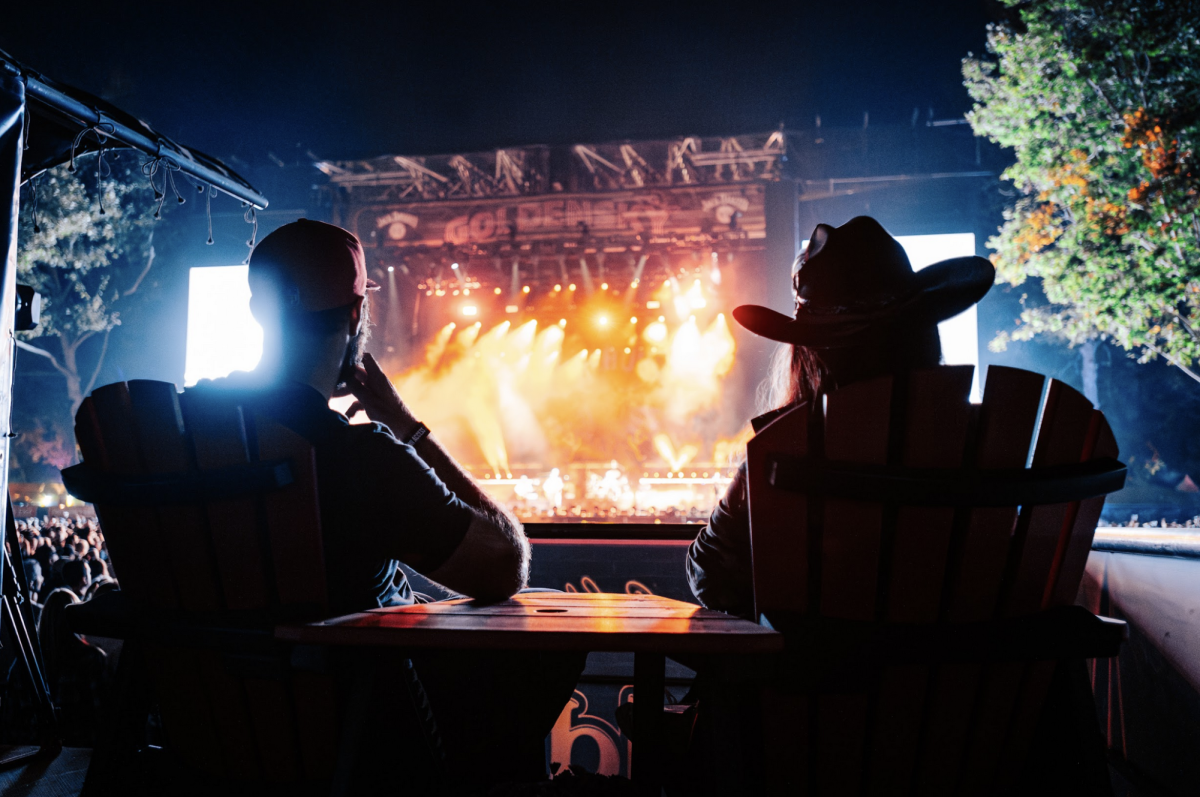 Two fans sit listening to a performance Sunday, Oct. 15, 2023. GoldenSky returns to Discovery Park for the third straight year. (Courtesy of Danny Wimmer Presents)