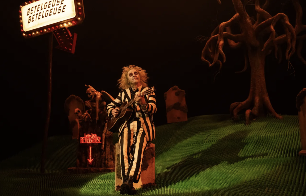 Betelguese (Michael Keaton) returns to haunt the Deetz family with his trademark theatrics and pranks. The beloved character returned to the big screen this fall in the long-awaited sequel “Beetlejuice Beetlejuice,” directed by Tim Burton. Photo courtesy of Warner Bros. Pictures.