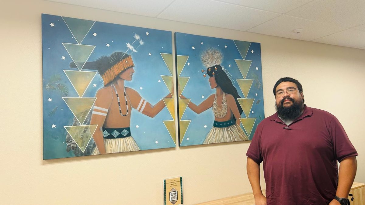 Advisor to the President for Tribal Community Relations and Native Student Success Joaquin Tarango stands by the mural at the Esak’Tima Center on Monday, Sept. 23, 2024. Tarango said the university is doing important work in returning its inventory of cultural items and remains.