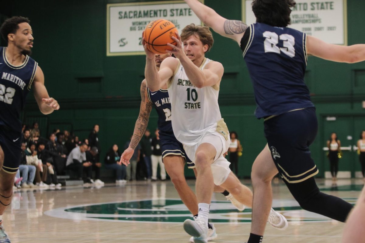 ophomore guard Emil Skytta drives to the basket against Cal Maritime Tuesday, Nov. 5, 2024. Skytta had a season-high in points, rebounds and assists in the loss to UC San Diego.