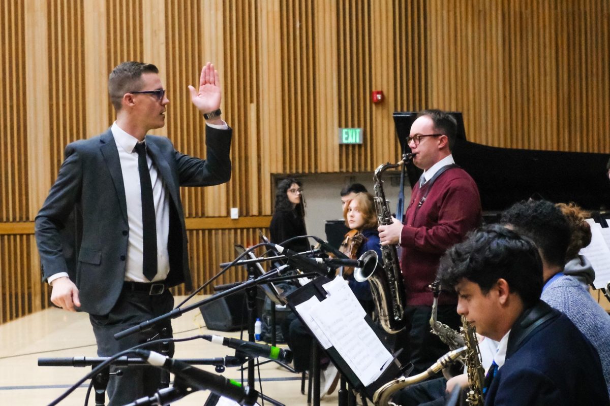 Jazz studies director and instructor Greg Johnson (left) leads a saxophonist through a solo during a rehearsal for the 1:30 p.m. Jazz Ensemble in Capistrano Concert Hall Thursday, Nov. 21. Colleague Duncan McElman directs the 3 p.m. Jazz Ensemble, which also performed on Thursday night, Nov. 21.