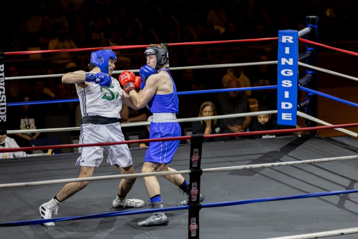 Combat U boxer Austin Melendez lands an uppercut on Air Force Academy boxer Justin Bonilla Friday, Nov. 22, 2024. Melendez was the first Sacramento State boxer of the night and earned the team’s first win.