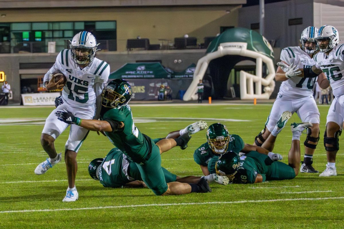 Portland State senior quarterback Dante Chachere runs through a Hornet defender Saturday, Nov. 2, 2024. Chachere ran for a career-high four touchdowns.