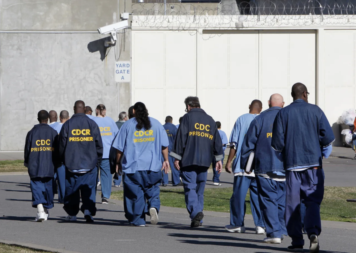 A group of inmates walk to perform their work duties at Folsom State Prison. Prop 6 would have allowed the incarcerated the option to decline work assignments. (Photo courtesy of Associated Press)