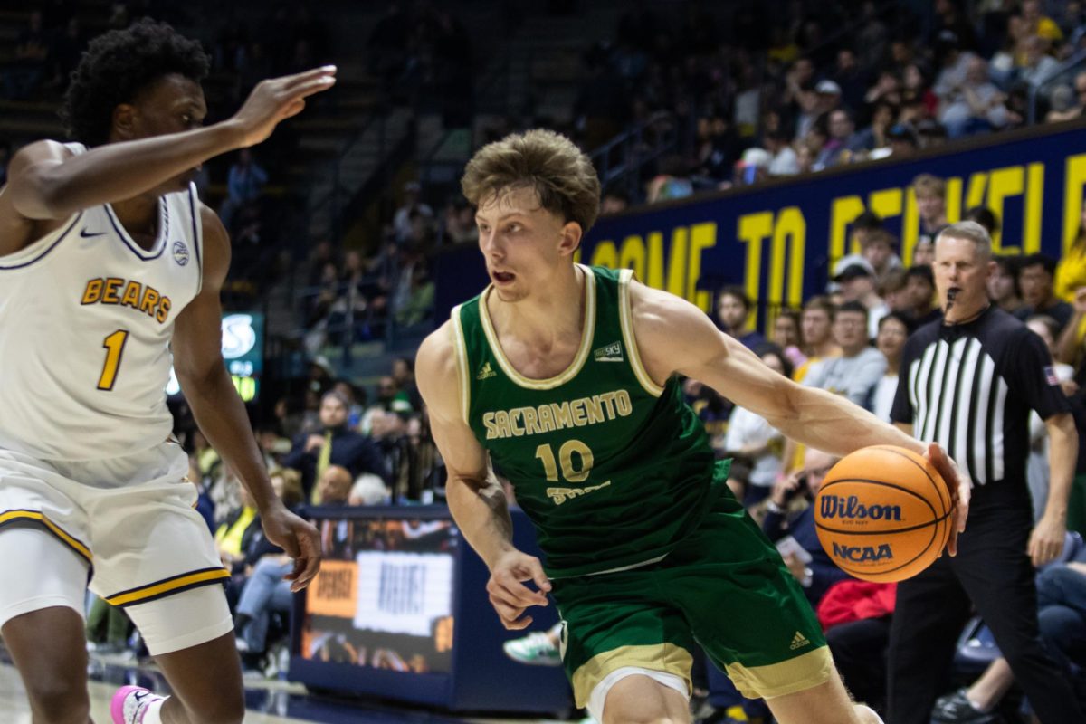 Sophomore guard Emil Skytta makes a move to get past a Cal defender Sunday Nov. 24, 2024. Vaughns posted a career-high in points at 18.