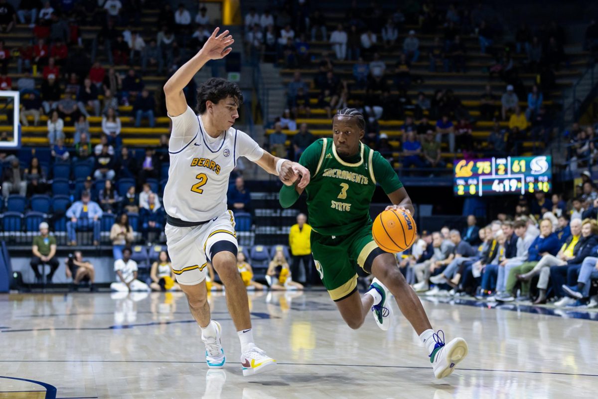 Senior guard EJ Neal drives past a Cal defender towards the basket Sunday Nov. 24, 2024. Neal ended with a career-high 16 points.