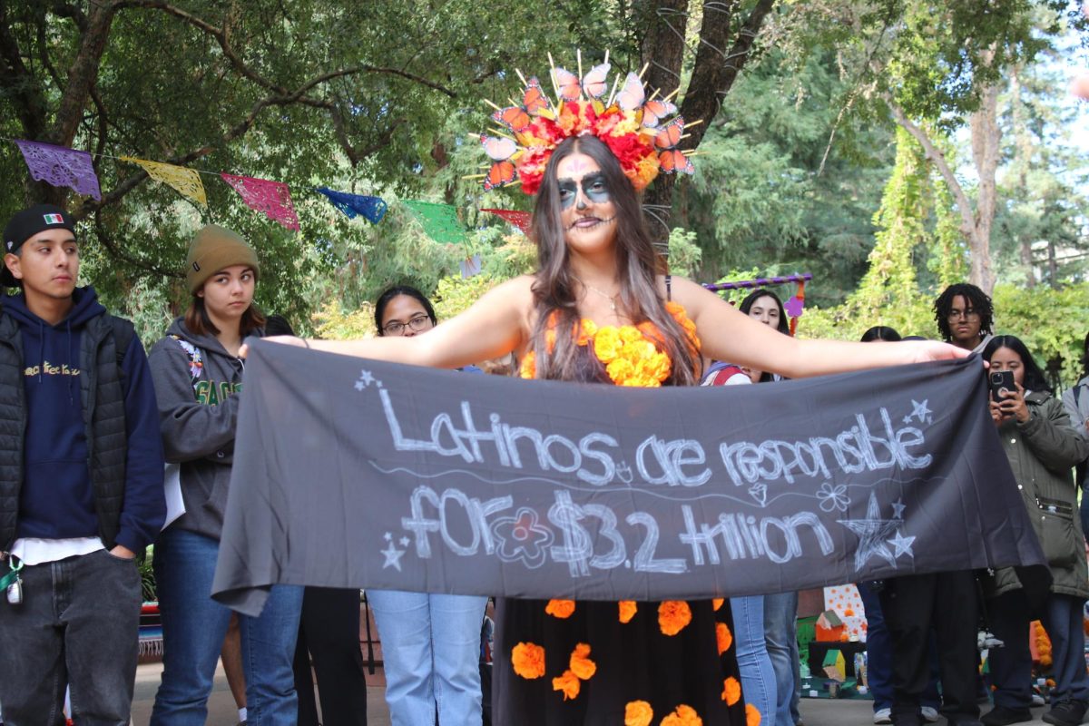 The 2024 Día de los Muertos communal gathering was held by the Barrio Arts and Ethnic Studies department in the library quad as students honor the lives of lost loved ones.