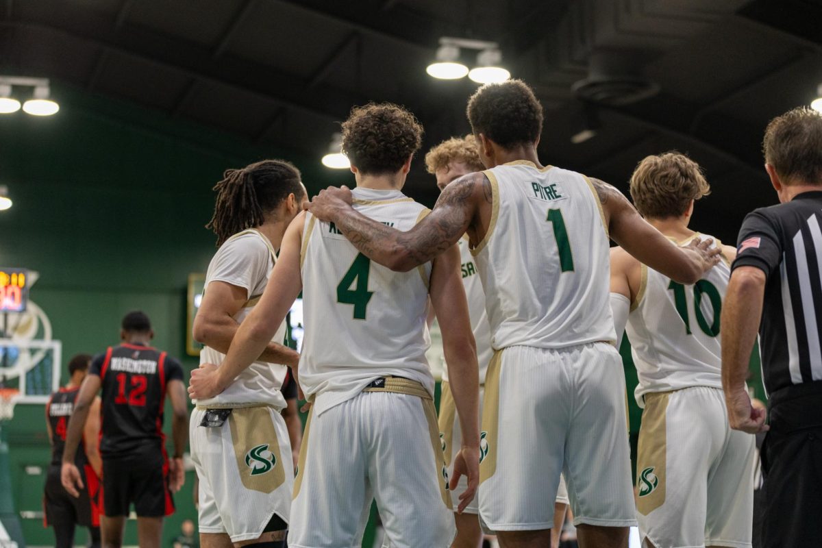 (L-R) Sophomore guard Alex Kovatchev and junior forward Jalen Pitre rally around their teammates against Cal State Northridge Saturday, Nov. 16, 2024. The Hornets are 6-15 on the season after losing their most recent matchup against Montana State.