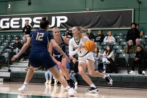 Sacramento State redshirt junior guard Benthe Versteeg dribbles past two Bobcat defenders Thursday, Jan. 30, 2024. Versteeg was the main playmaker, scoring eight and dishing out five assists.