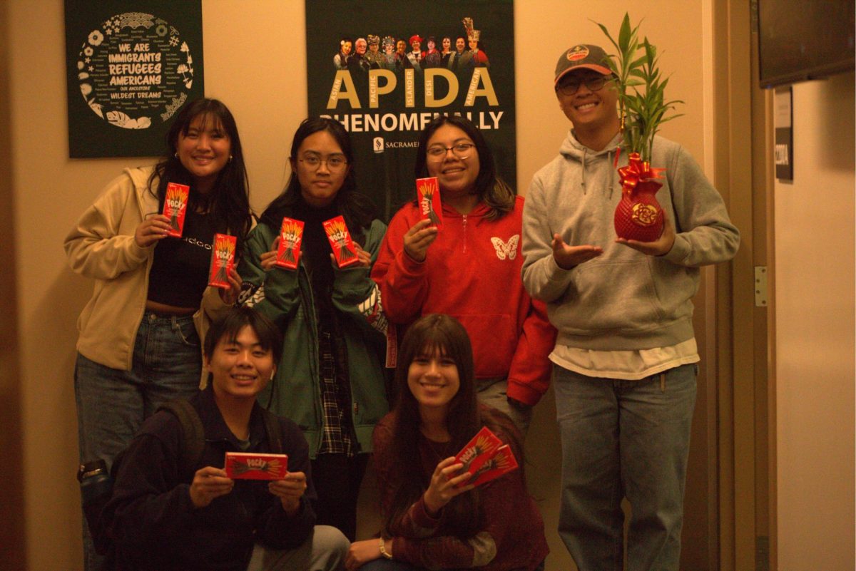 The Sacramento State APIDA Center students and staff celebrate with red envelopes Tuesday, Jan. 28, 2025. The red envelopes represent the tradition of Hóngbāo to protect sleeping children. 