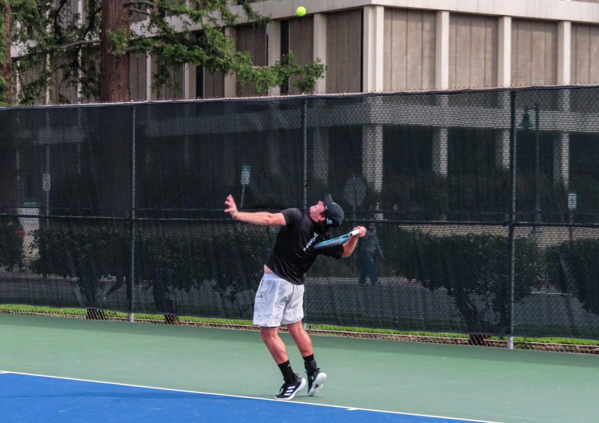 Senior Hayden Rand sets up to serve against St. Mary’s in a singles match Monday, Feb. 24, 2025. Sac State would go on to take the match at home.