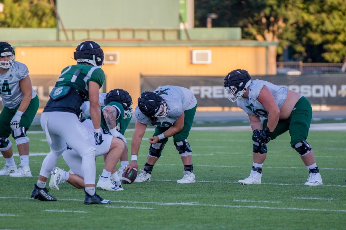 (L-R) Sac State seniors, center Kaden Richardson and guard Jackson Slater, ready for the snap at practice Friday, Aug. 23, 2024. Slater said the Richardson family has been an important factor in his development as a player.