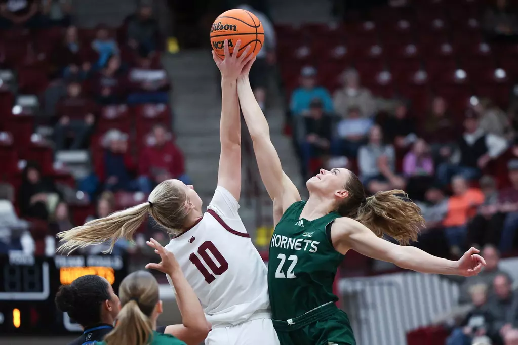 Sophomore guard Lina Falk leaps for the tip-off against Montana, Thursday, February 28, 2025. The Hornets won the interior battle, with more rebounds and paint scores. 
(Photo courtesy of Taylor Decker, University of Montana Athletics). 
