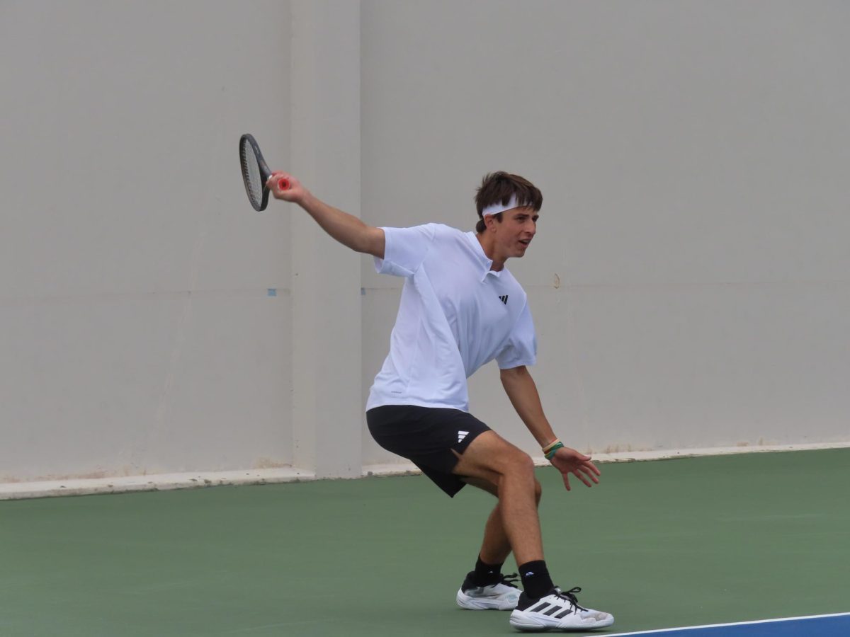 Freshman Martin Duris returns the ball with a forehand motion at fifth doubles Saturday, March 15, 2025. Duris swept in two sets contributing to the 7-0 victory against Eastern Washington. 