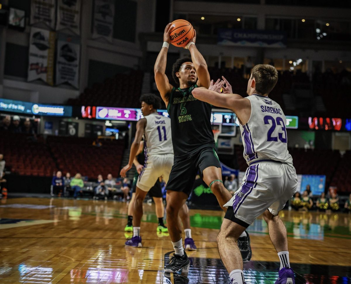 Sophomore guard Michael Wilson takes a contested jump shot against Weber State Saturday, March 8, 2025. The Hornets fell to Weber State in the Big Sky Conference tournament, ending their season.