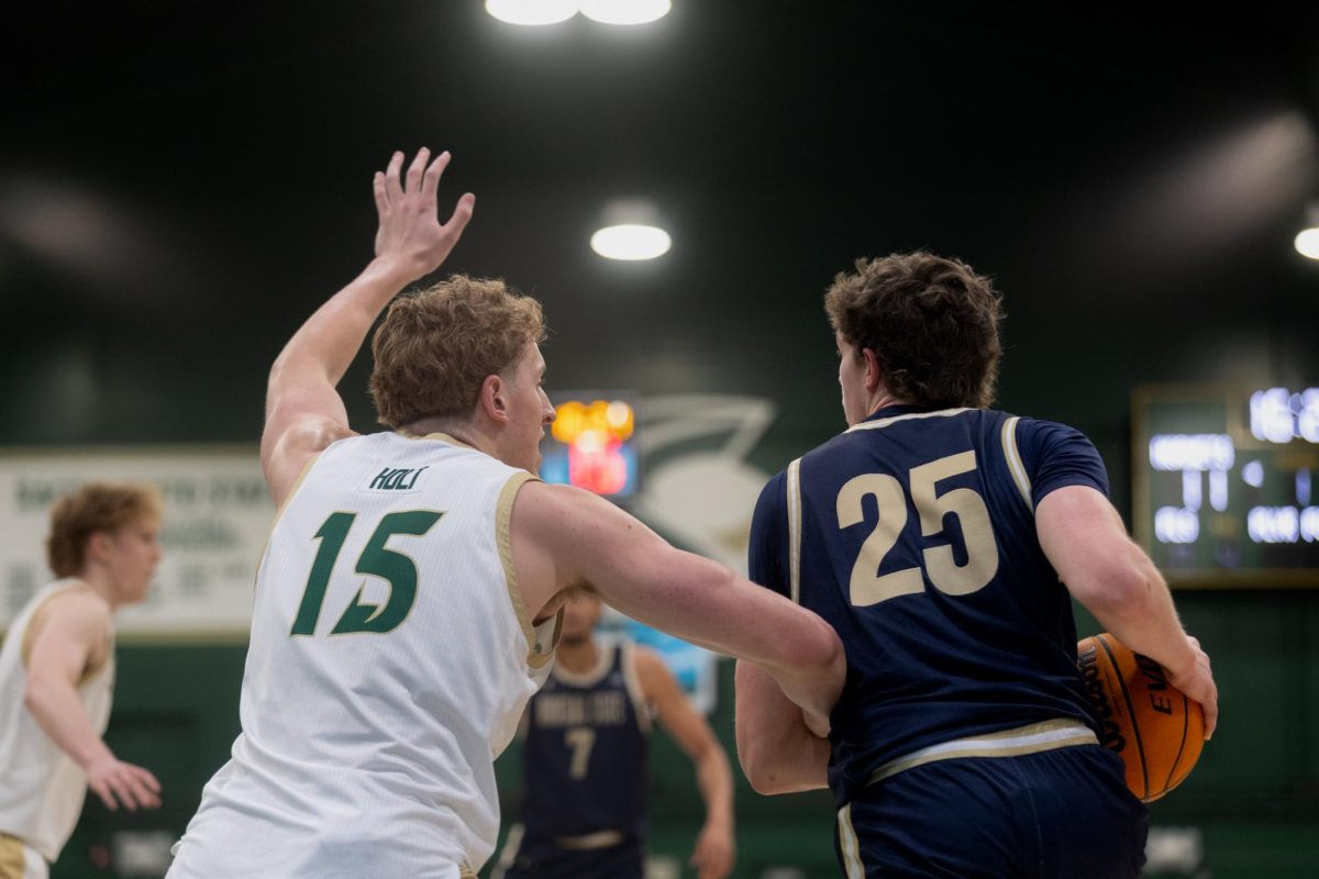 Senior forward Jacob Holt guards his opponent away from the basket against Montana State Saturday, March 1, 2025. Holt led the Hornets in scoring for the twentieth time this season.