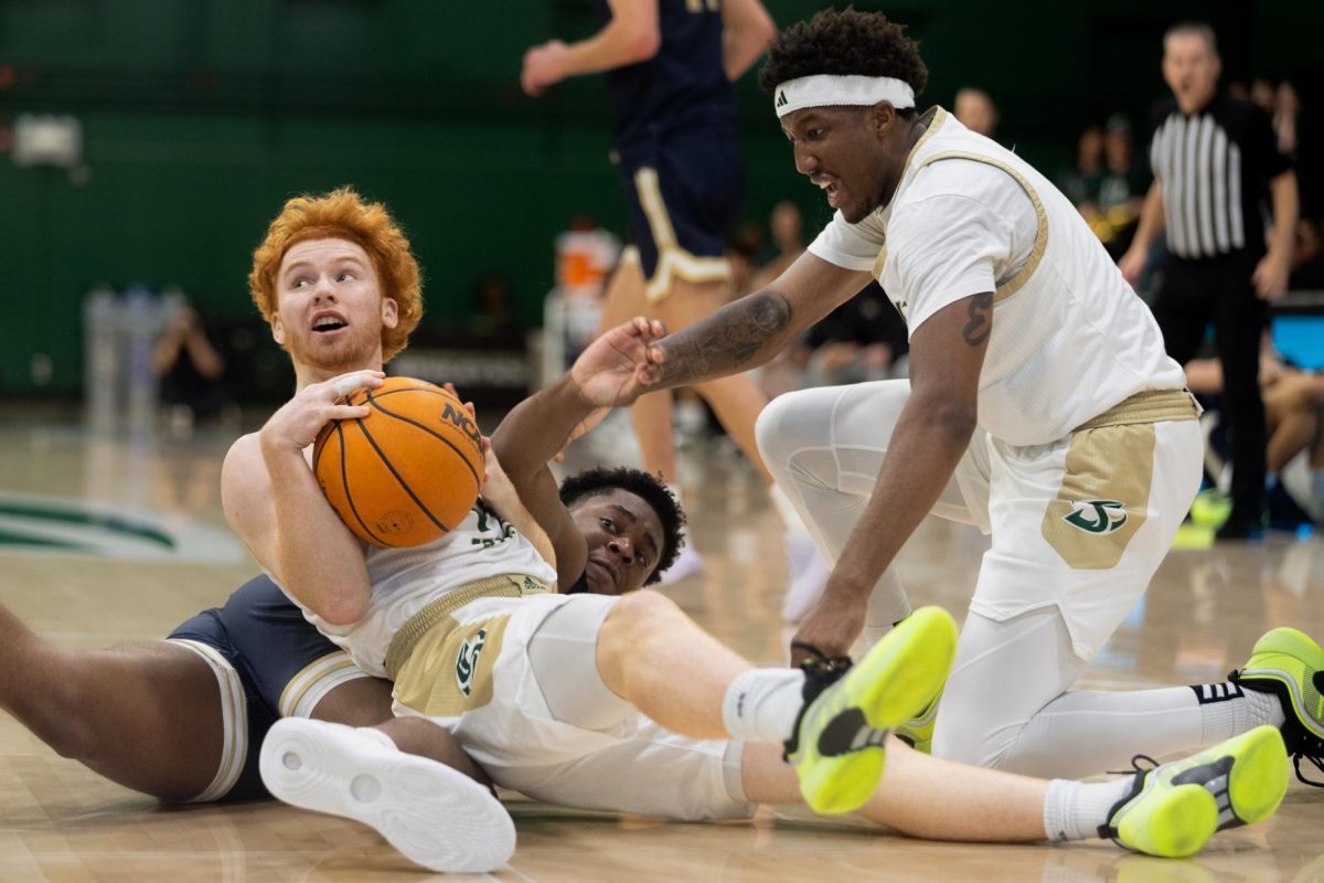 Freshman guard Leo Ricketts and senior guard EJ Neal dive for a loose ball in their match against Montana State Monday, March 1, 2025. Sac State lost their season finale 56-59 to Portland State.