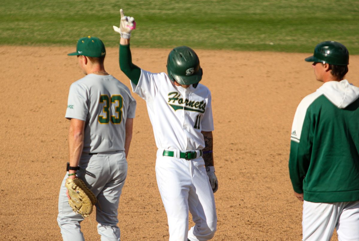 Senior outfielder Tyler White celebrates after reaching first Friday, Feb. 14, 2025. White went 2-for-4 at the plate in Tuesday’s game against the Tigers, scoring once.