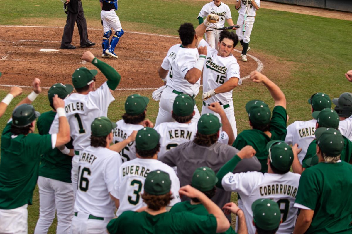 JP Smith and Jakob Poturnak bash arms together after hitting back-to-back home runs Thursday, Feb. 27, 2025. Poturnak added another in the fifth, adding to his team-leading six homers.