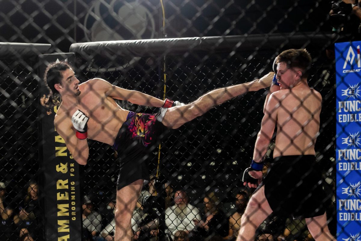 A1 Combat Fighter Amir Najjar lands a head kick against A1 Combat fighter Michael Seely Friday, March 7, 2025. Najjar won the bout by unanimous decision.