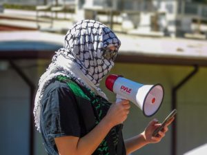 Protesters gather in support of Mahmoud Khalil at the Sacramento State Library Quad Tuesday, March 11, 2025. The speakers at the protest spoke about freedom of speech and President Donald Trump's executive order aimed at combating antisemitism. 