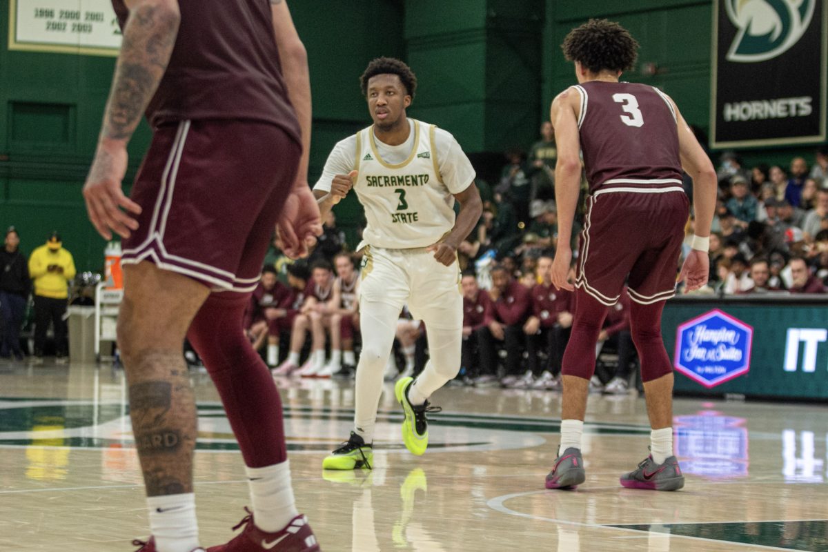 Senior guard EJ Neal communicates the play with his teammate against Montana Thursday, Feb. 27, 2025. Neal led the game with three 3-pointers. 