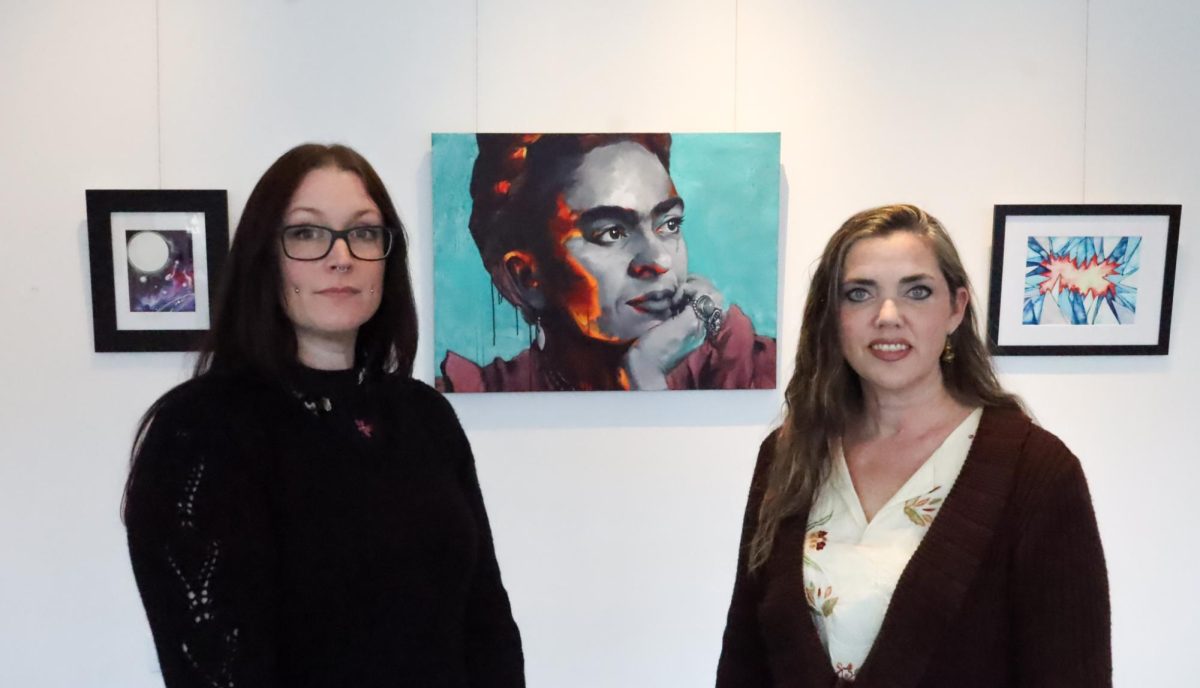 Michelle Dahl and Gina Grice in front of some of their work Thursday, March 13, 2025. Their art is on display at Gallery 1075 in West Sacramento until March 31.