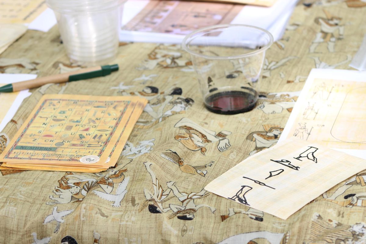 Various hieroglyphic symbols are scattered across the hieroglyphic sketching table at the SWANA festival Tuesday, April 15, 2025. Volunteers shows festival participants the unique way of writing with hieroglyphics.
