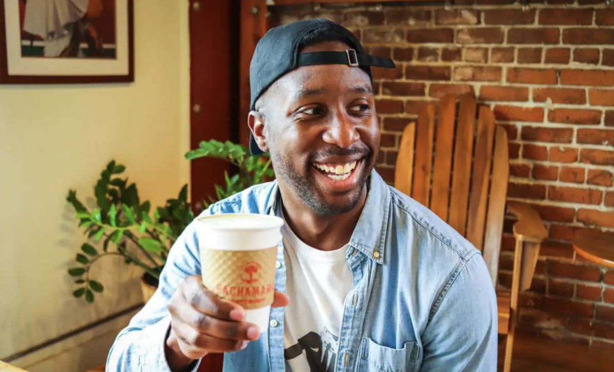 Alex Blaise, also known as SacBoyEats, enjoys a moment with a coffee in hand. The candid shot captures his enthusiasm for local coffee shops, a key part of his mission to celebrate  Sacramento’s diverse food scene and local eateries. (Photo courtesy of Erin Blaise)
