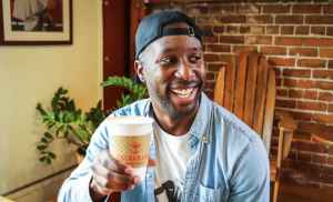 Alex Blaise, also known as SacBoyEats, enjoys a moment with a coffee in hand. The candid shot captures his enthusiasm for local coffee shops, a key part of his mission to celebrate Sacramento’s diverse food scene and local eateries. (Photo courtesy of Erin Blaise)

