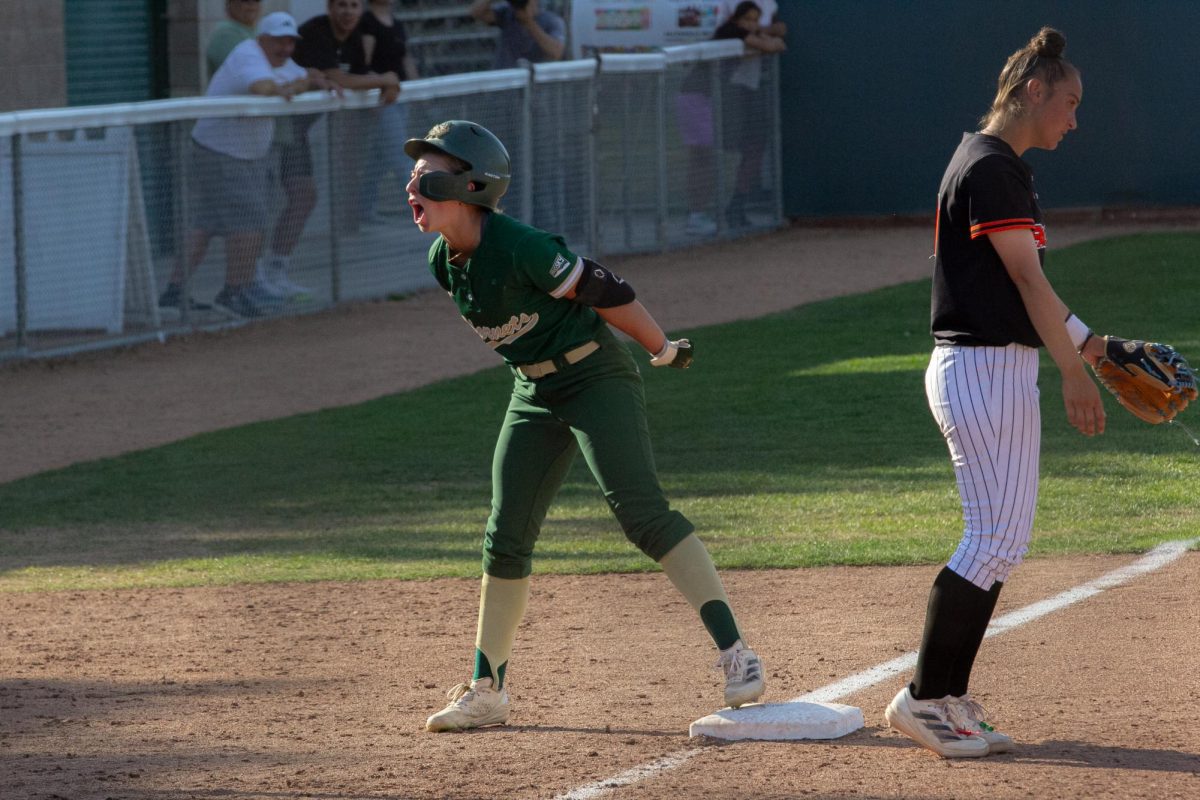 Junior outfielder Faith Epperson yells in celebration after stealing third base Wednesday, April 30, 2025. Sac State won this game soundly, ending 9-1 against Pacific.