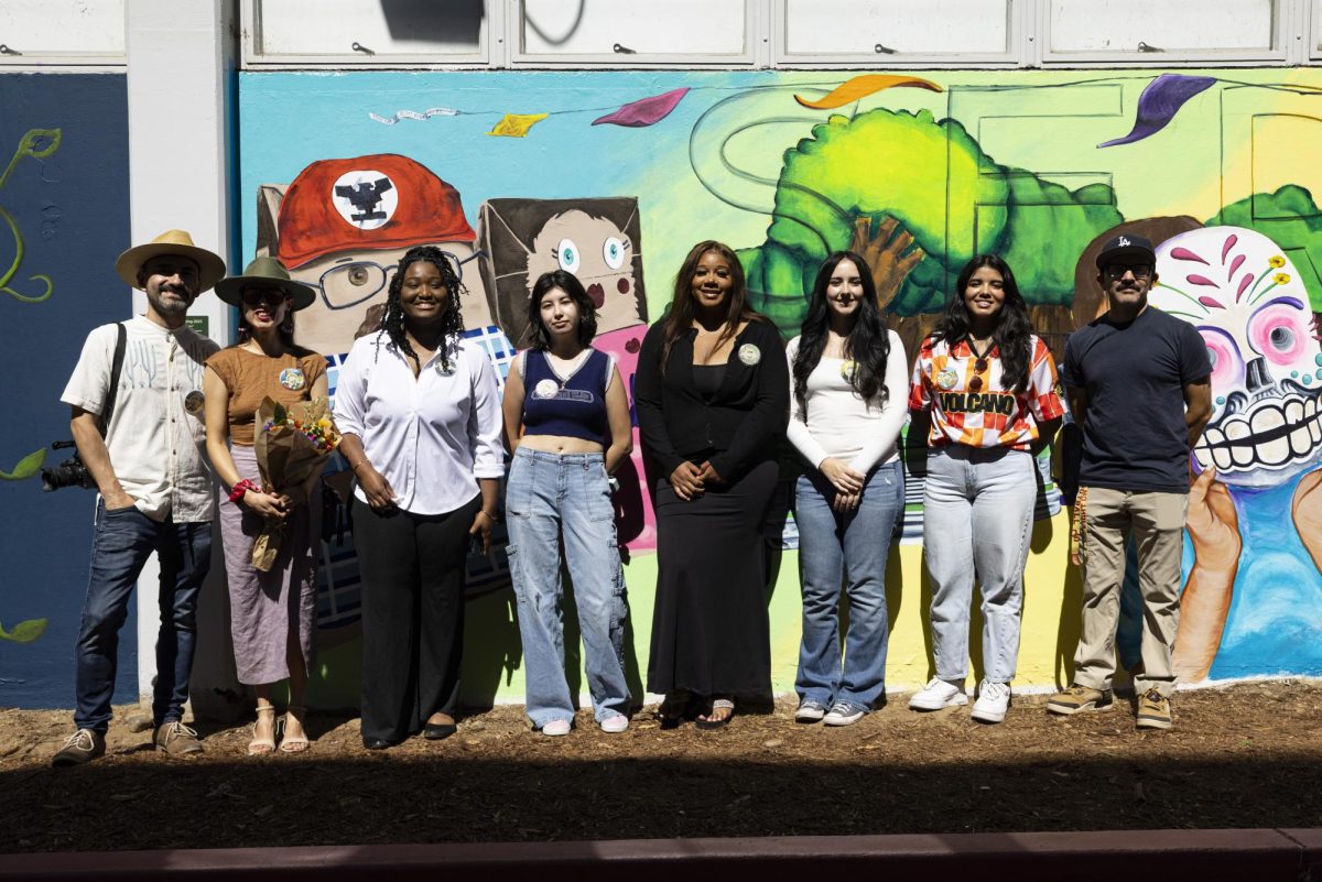 Vibrant colors of the newly installed art mural along the Ernest E. Tschannen Engineering Teaching and Research Building turn heads as spectators come for the unveiling, celebrating a place where all can feel they belong.	