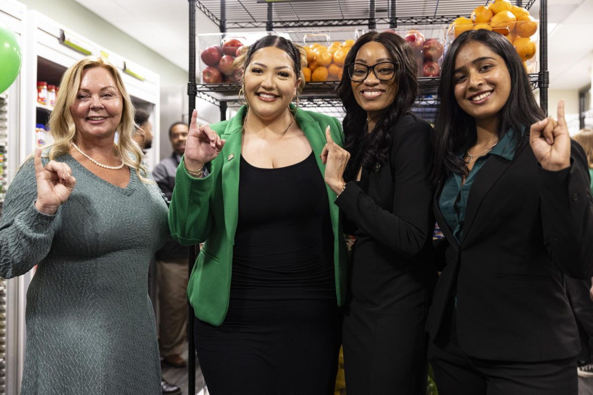 (From left to right) Senior Associate Vice President of SHCWS Jeanne Harris Van Dahlen, former ASI Student Body President Nataly Andrade-Dominguez, Student Affairs Vice President Aniesha Mitchell and current ASI President Aranjot Kaur put their stingers up at the Basic Needs Resource Center Grand Opening at The WELL Tuesday, Sept. 23, 2025. The event showcased the collaboration between student leaders and administrators in addressing basic needs insecurity. 
