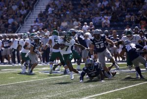 Junior quarterback Cardell Williams evades Nevada defense for a scrambled first down. Williams relieved redshirt sophomore quarterback Jaden Rashada after a head injury sidelined the starter, Sept. 6, 2025.