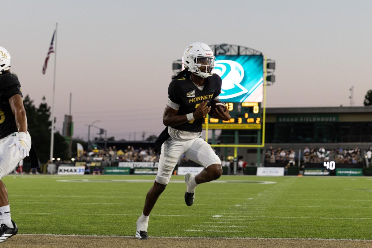 Junior quarterback Cardell Williams punches in one of his two touchdowns in Sac State’s win over Central Arkansas Saturday, Sept. 20, 2025. Williams racked up over 300 total yards and three touchdowns for his strongest game as a Hornet. 