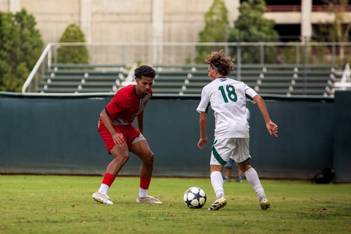 Freshman forward Zach Looney looks for options as he staves off a St. Mary’s defender on Friday, Sept. 19, 2025. Sac State went on to draw the match by a score of 1-1.