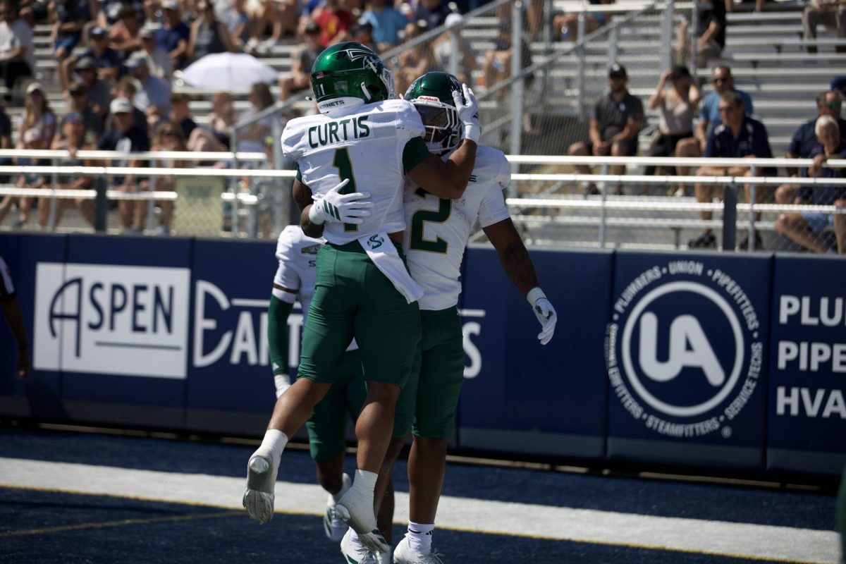 Senior running back Jamar Curtis and senior running back Rodney Hammond, Jr. celebrate an early touchdown against Nevada Saturday, Sept. 6, 2025. Curtis and Hammond, Jr. led an improved Sac State rushing attack in a 20-17 loss to the Nevada Wolf Pack.