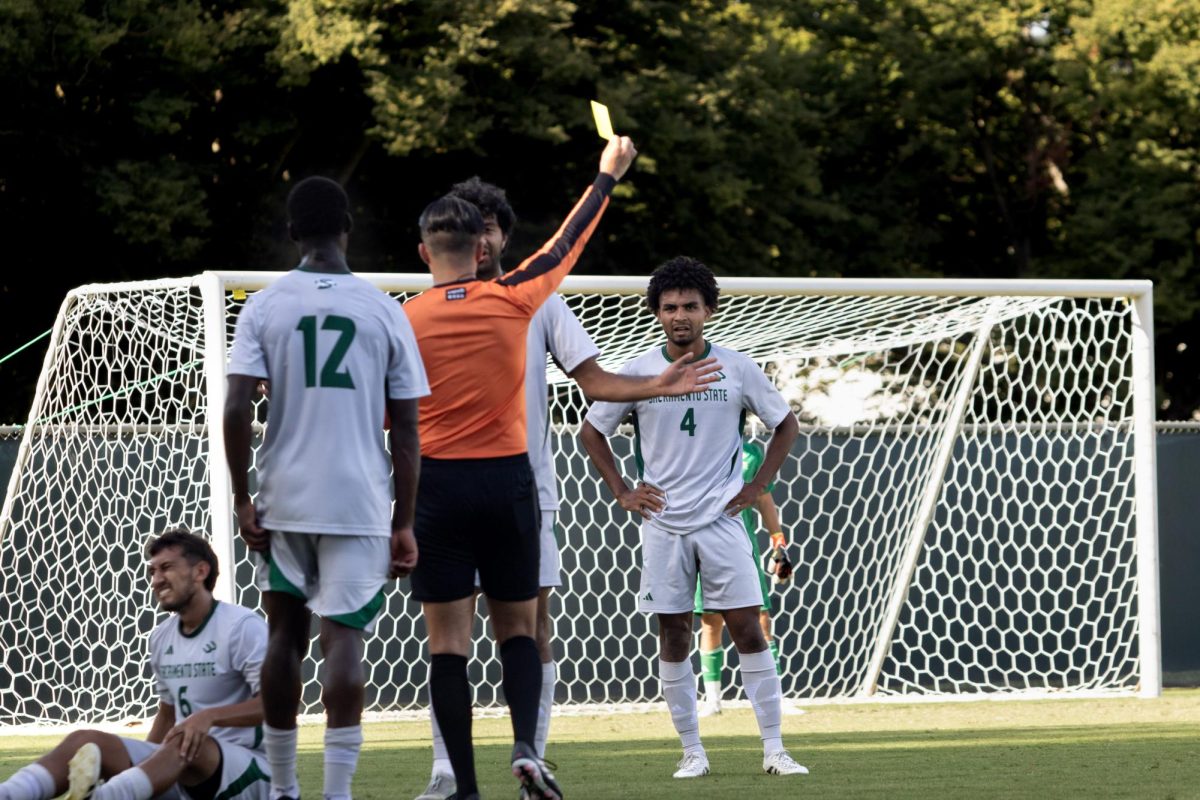Senior midfielder Amjot Narang receiving a yellow card from the referee against San Jose State on Sept. 7, 2025. Sac State earned seven yellow cards during the game.