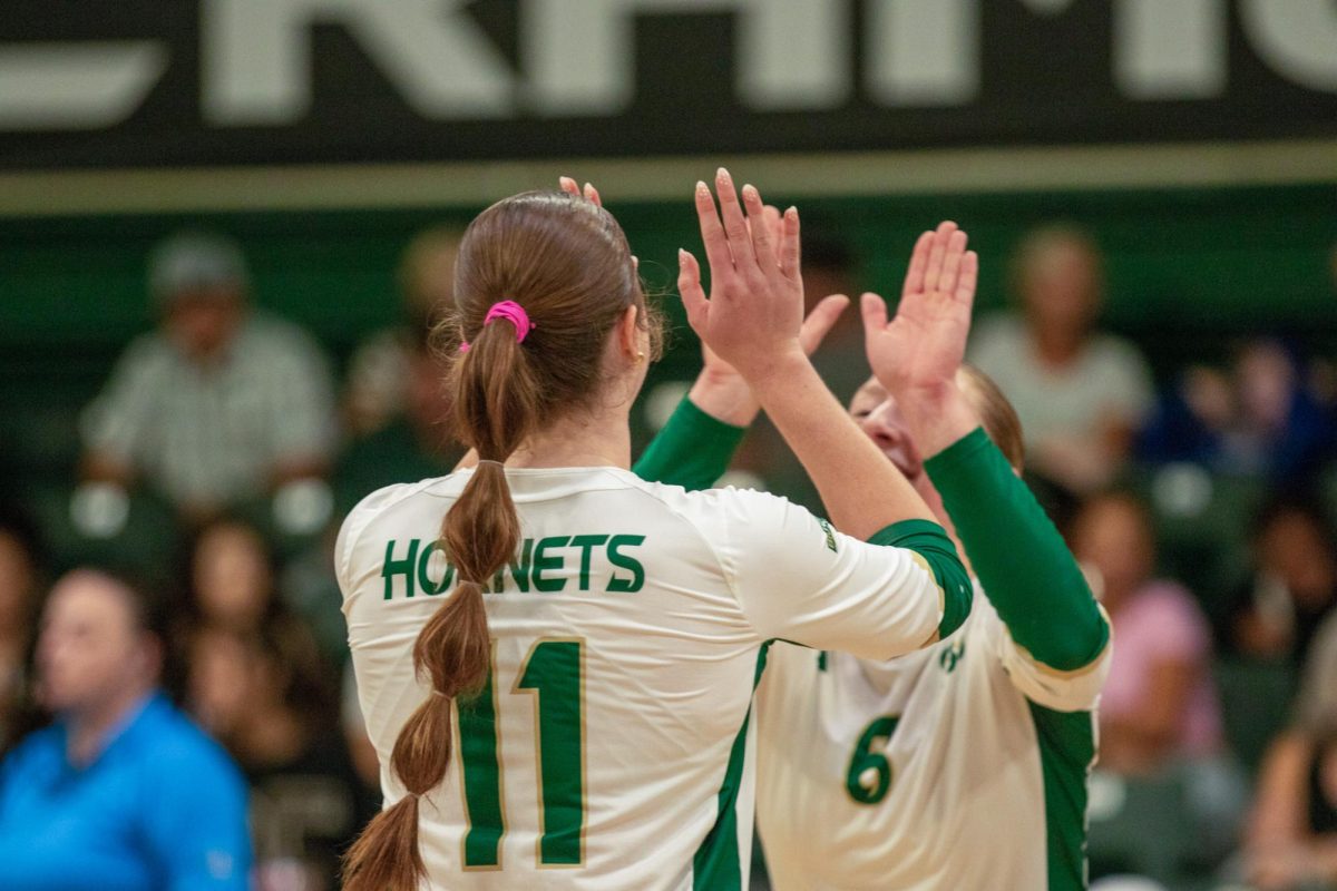 Victoria Marthaler celebrating with Greta Davis on Sept. 20, 2025. The Hornets will be back at home Thursday at 7 p.m. against Montana.